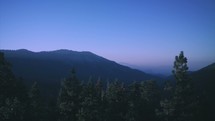 Mountains and valley forest during sunrise