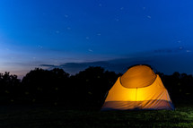 glowing tent at night 