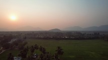 Drone footage of the sun rising in the rice fields of Vizag Visakhapatnam, India,