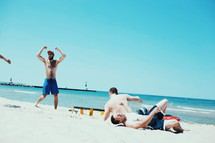 men having fun on a beach 