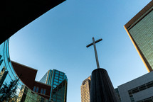 cross on a church in a city 