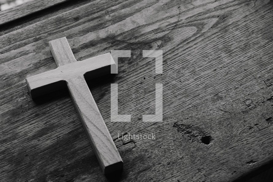 cross on wood desk 