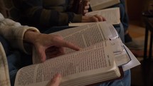 People studying the Bible at a small group meeting in a home