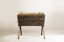 wooden manger with hay. 