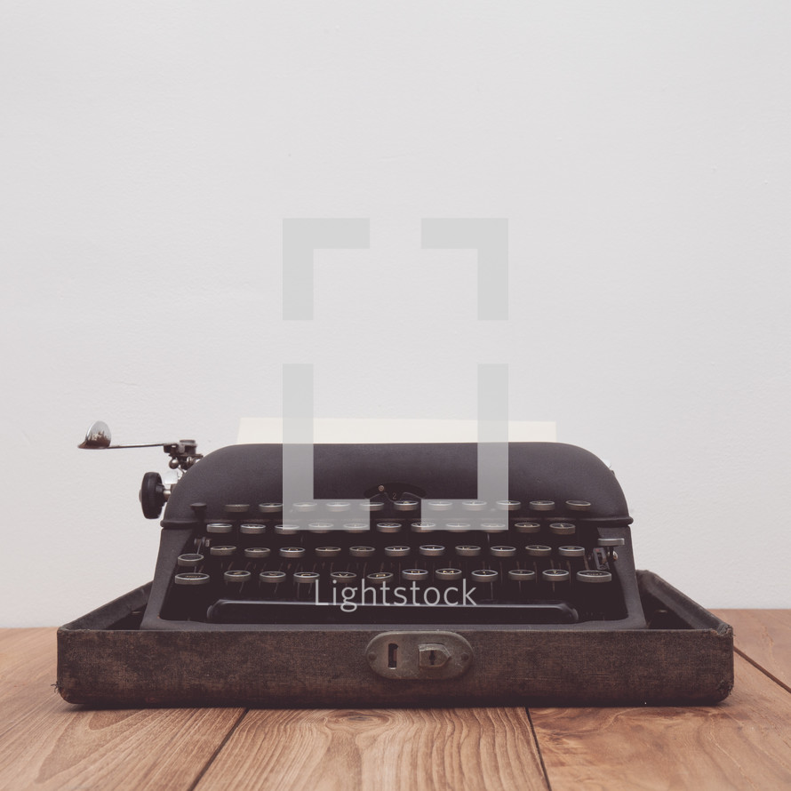 vintage typewriter on a wood table 