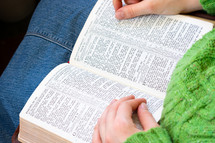 girl reading a Bible in her lap