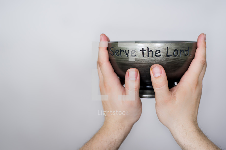 hands holding up a Serve the Lord Bowl
