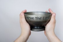 Serve the Lord bowl lifted in the air