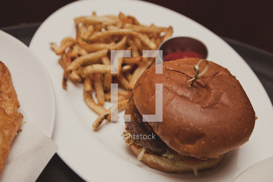 Hamburger and french fries on a plate