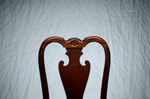 top of a chair in front of a white background