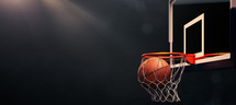 Basketball. Scoring basket with black background and empty space
