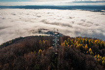 Aerial Drone Shot: Sightseeing Tower in Brezno, Autumn Scenery with Misty Morning and Cloud Inversion in Horehronie Region