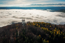 Aerial Drone Shot: Sightseeing Tower in Brezno, Autumn Scenery with Misty Morning and Cloud Inversion in Horehronie Region