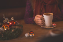 a woman with a peppermint latte for the holidays 