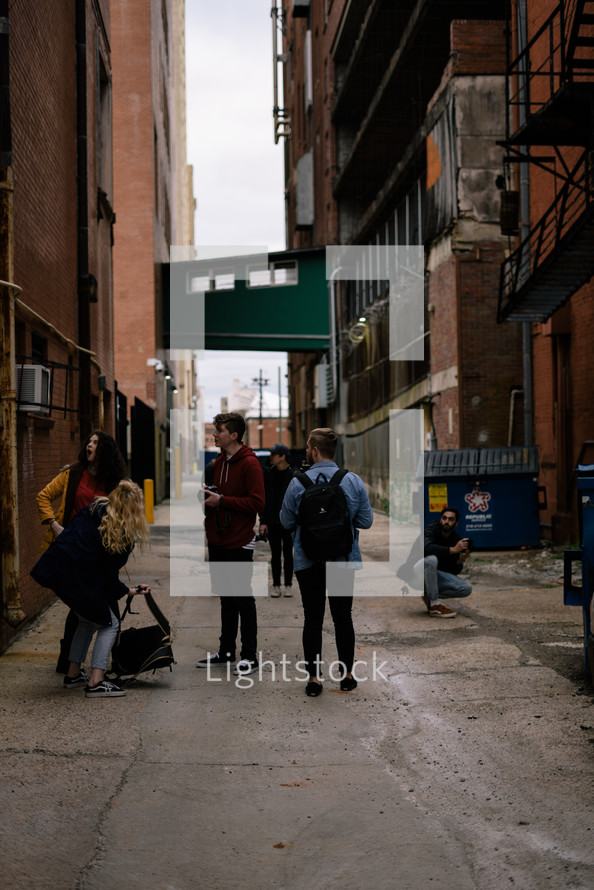 friends standing in an alley 