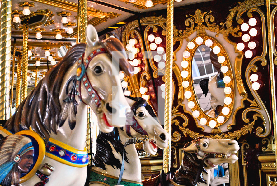 Carousel ponies racing endlessly to nowhere.