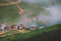 Foggy and sunny summer in the mountain village