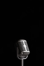 microphone against a black background.