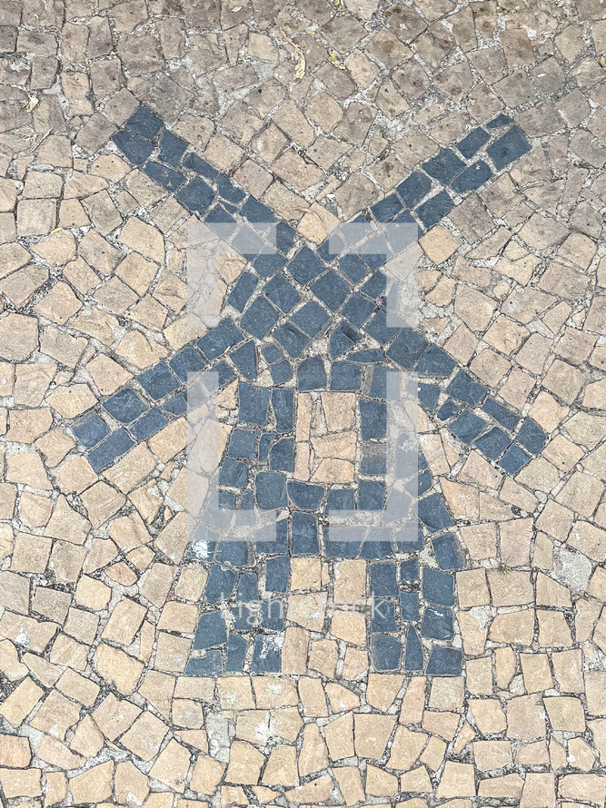 Paving stones with shapes of a Dutch Windmill. Holambra, SP, Brazil. June 30, 2024.