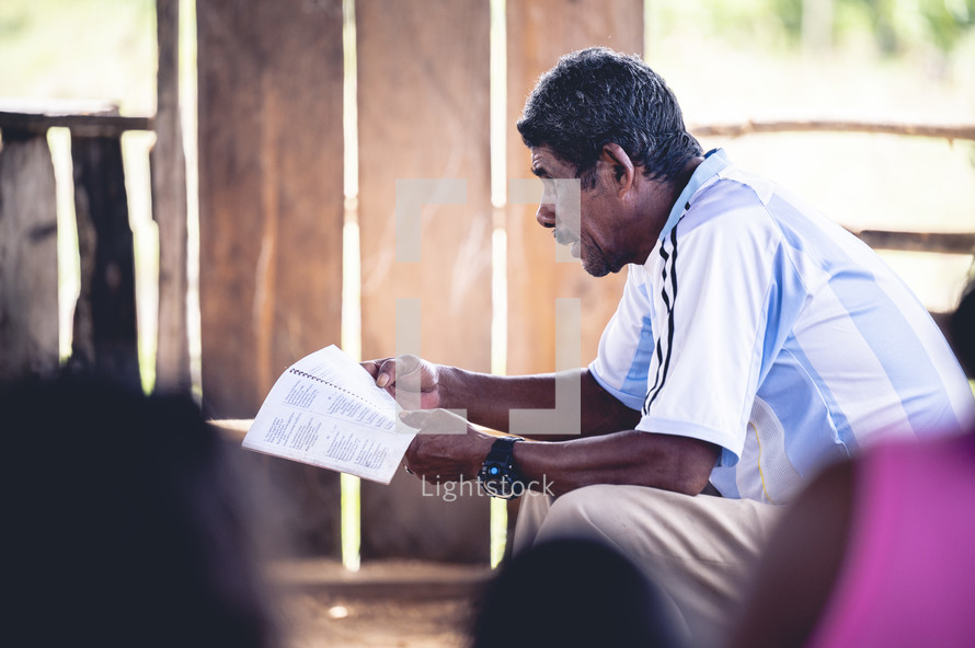 man reading scripture in Honduras 