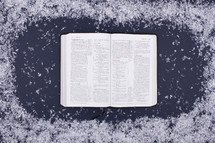 open Bible and snow border 