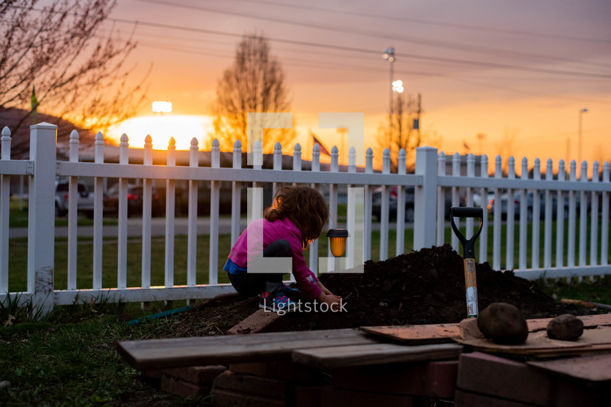 child playing in dirt 