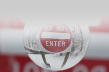 do not enter sign and snowy scene in a glass orb 