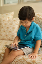 toddler boy using an iPad 