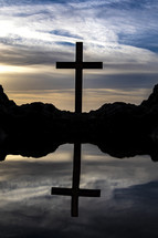 tide pool and silhouette of a cross