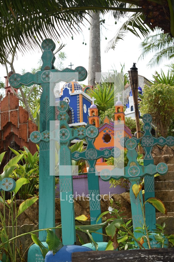 colorful crosses and memorials to the dead in a Mexican Cemetery, day of the dead, dia de los Muertos 