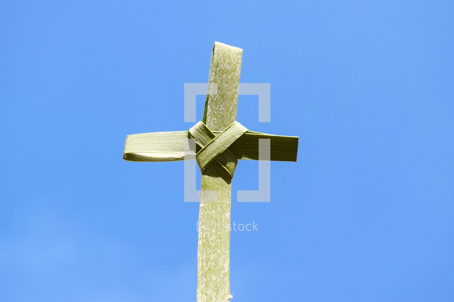 palm cross against a blue sky 