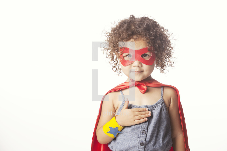 Child dressed up like a superhero.