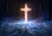 christmas lights on a cross in snow 