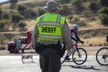 A sheriff directing traffic at an event