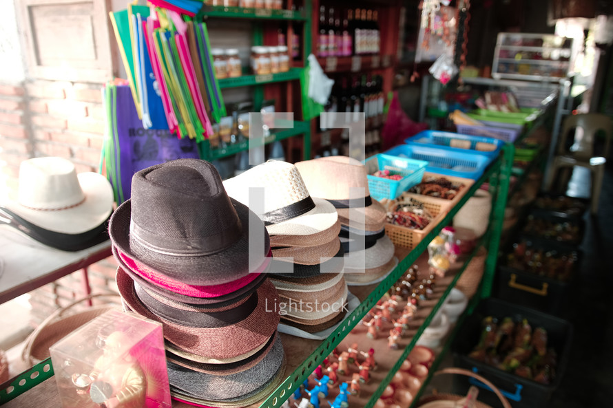 hats and trinkets for sale in a shop 