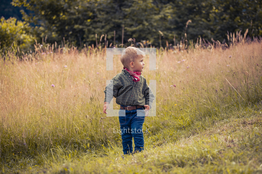 Cute Little Boy in Western Costume with Jeans and Bandana