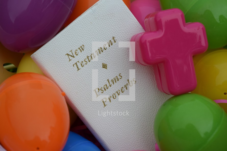 The New Testament, Psalms, and Proverbs Bible in a bucket full of Easter Eggs 