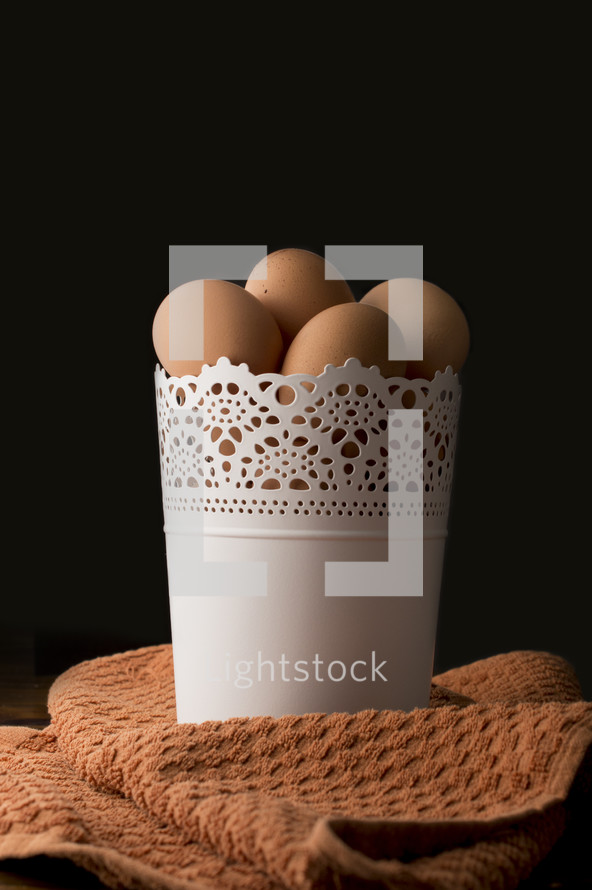 brown eggs in a bucket 