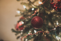 Red Christmas ornament on a Christmas tree