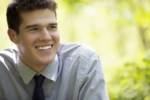 young man in a tie smiling