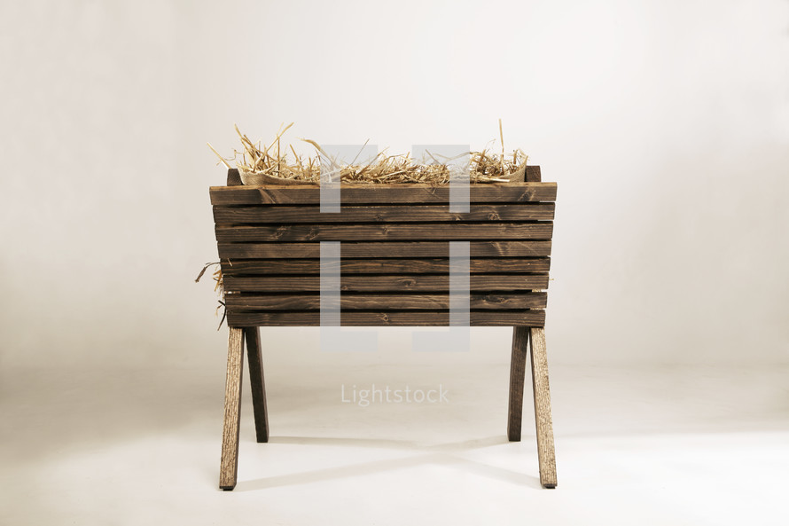 wooden manger with hay. 