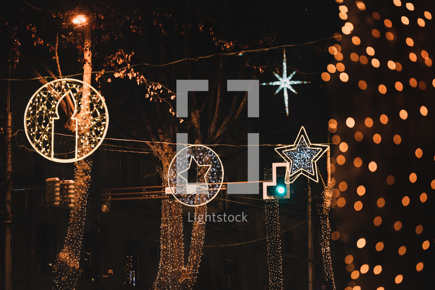 Illuminated Christmas toys in the street at night