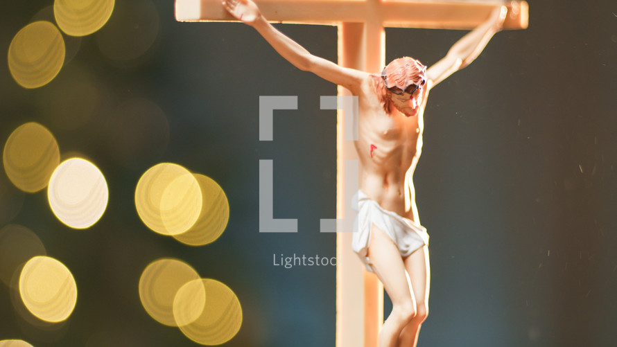 Jesus On the cross with blurred lights glowing 