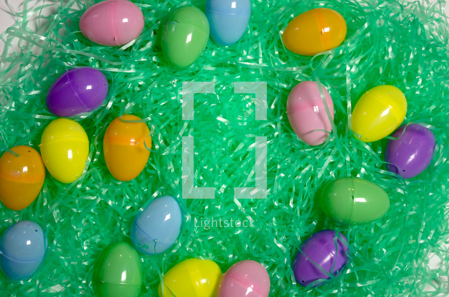 plastic Easter eggs and green Easter grass 