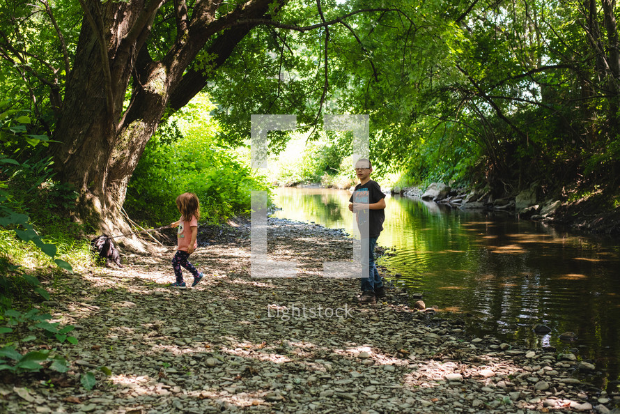 kids playing by a summer stream 