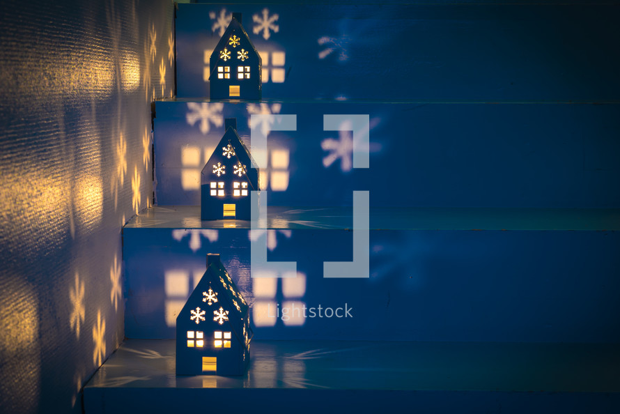 house shaped luminaries on steps at Christmas 