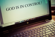 words God is in control on a computer screen 