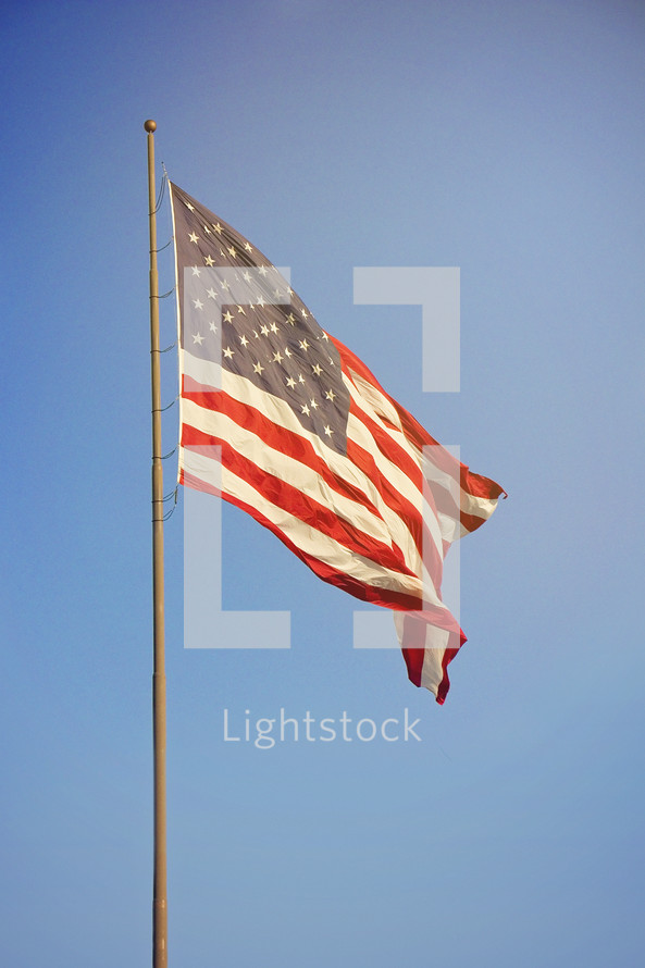An American flag on a flagpole 