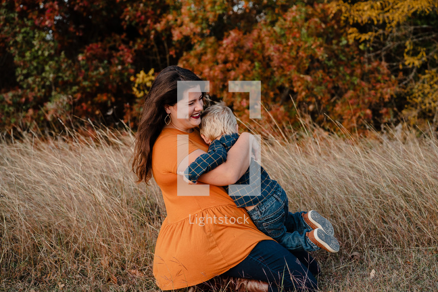 portrait of a mother and son outdoors in fall 
