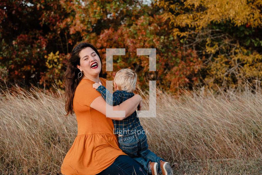 portrait of a mother and son outdoors in fall 